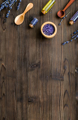 organic cosmetics with lavender on wooden background top view