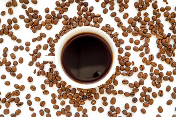 coffee beans on gray with coffe cup table top view