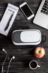 virtual reality glasses on man working desk top view