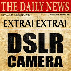 DSLR camera, newspaper article text