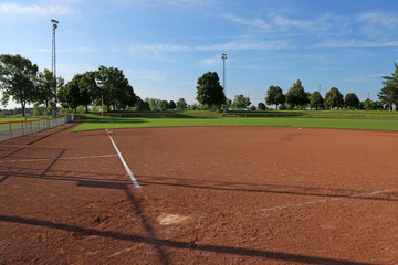 An empty softball field on a sunny day..