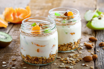 Delicious healthy American breakfast made of granola, yogurt and fruits. Classic US morning meal....