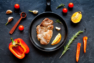 concept cooked steak on dark background top view