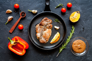 concept cooked steak on dark background top view
