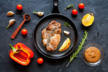 concept cooked steak on dark background top view