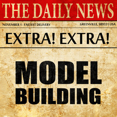 Fototapeta premium model building, newspaper article text