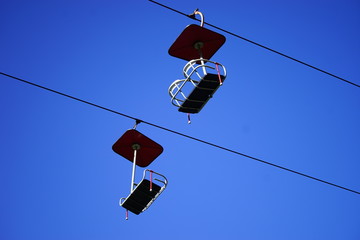 Obraz premium A pair of chairlifts
