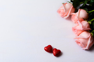 Pale pink roses and red glitter hearts