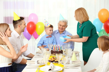 Family celebrating grandfather's birthday together