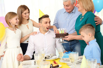 Family celebrating father's birthday