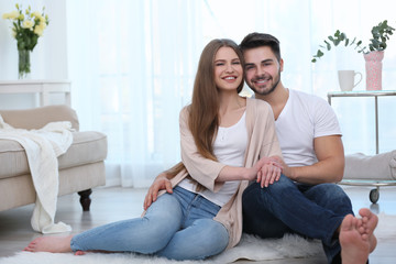 Obraz premium Cute young couple together at home