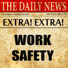 Work safety sign, newspaper article text