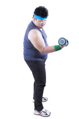 Obese man exercising with dumbbells on studio
