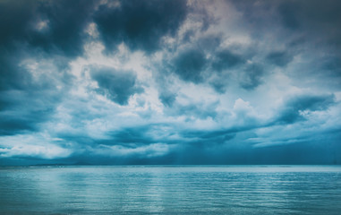 Naklejka na ściany i meble Dramatic sky over the sea, stormy weather