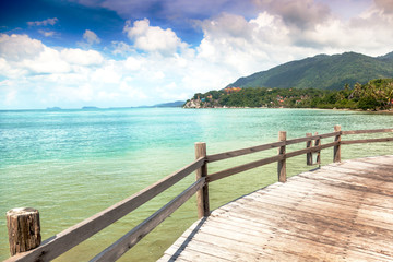 Long wooden bridge pavilion in beautiful tropical island beach s