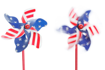 Stars and stripes pinwheels, one stationary and one spinning