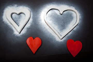 Holidays gift and heart on a black background. Valentines day