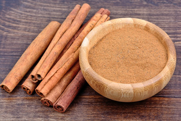 Bamboo bowl with cinnamon on table
