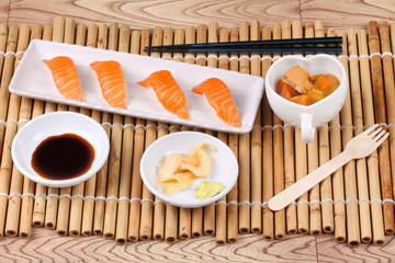 Salmon sushi and side dish served with Japanese yellow curry.