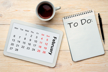 february calendar grid and to do concept