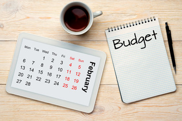 february calendar grid and budget concept