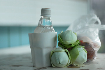 Set morning offerings of  food, money and lotus for monk.