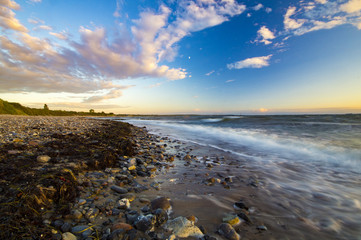 Obraz premium sea landscape, waves breaking on the breakwater pile of wood, baltic sea