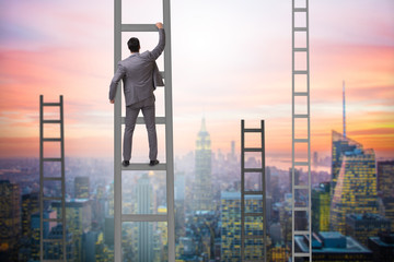 Young businessman climbing career ladder © Elnur