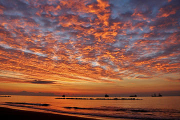 Fototapeta na wymiar Dramatic sky before sunrise in the Mediterranean