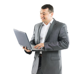 Business man with laptop on background of office