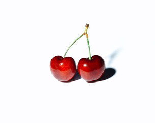 Two cherries isolated on white background