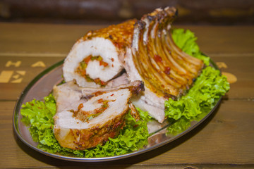 A hefty piece of meat stuffed with vegetables.