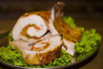 A hefty piece of meat stuffed with vegetables.