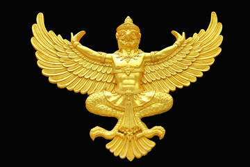 Golden garuda statue isolated on black background