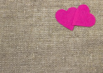 A two decorative pink hearts on gray background