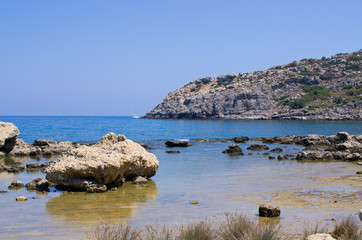 Fototapeta na wymiar Rocky beach on Rhodes island, Greece