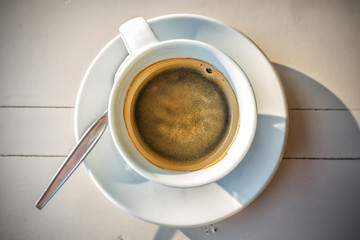 top view of bubble hot coffee and shadow