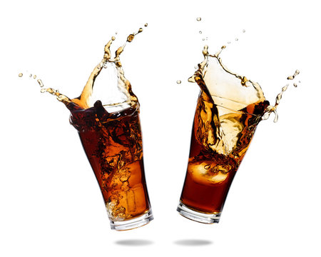 Couple cola splashing out of a glass., Isolated white background.