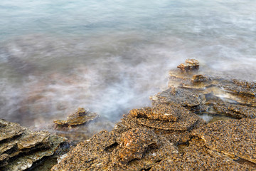 Aegean shore in Greece, Thassos island - waves and rocks - long exposure photography
