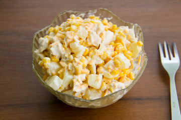 Festive salad with chicken breast, sweet corn, cheese and pineap