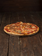 Pizza with mozzarella on dark background