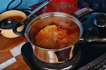 Stuffed cabbage rolls cooking in a pot