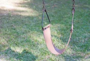 swing on green grass background