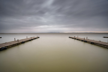 Obraz premium Storm over Albufera with 2 piers, Valencia