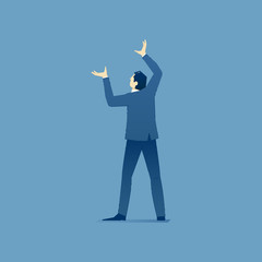 Businessman stands and holds something over his head