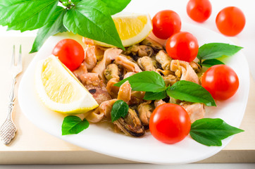 Mussels, squid and octopus, decorated with greens