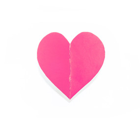Pink paper heart with shadow isolated on white background