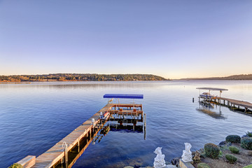 Private dock with jet ski lifts and covered boat lift, Lake Washington.