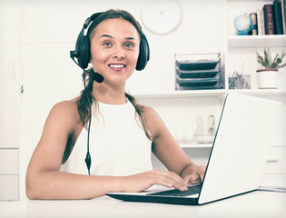 Naklejka premium young woman with head set at office.