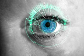 Eye of a woman with digital interface in front of it